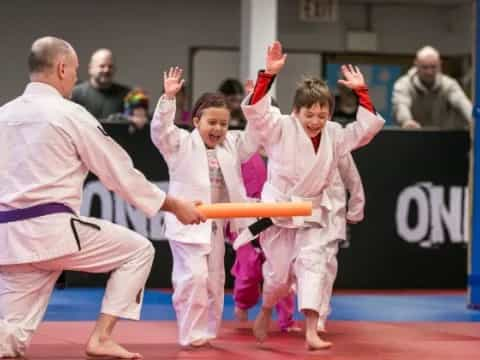 a group of people in karate uniforms