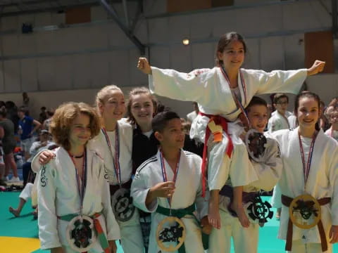 a group of people wearing medals and posing for a photo