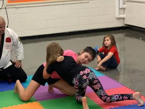 a group of children on a mat