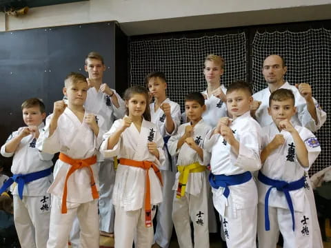 a group of people in karate uniforms