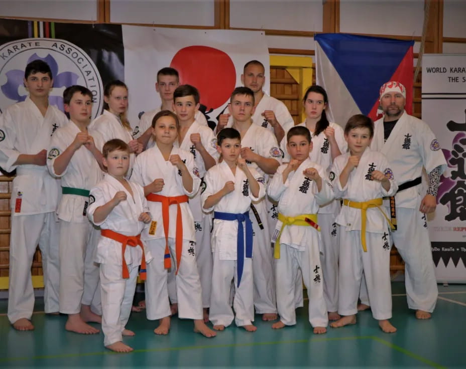 a group of people in karate uniforms