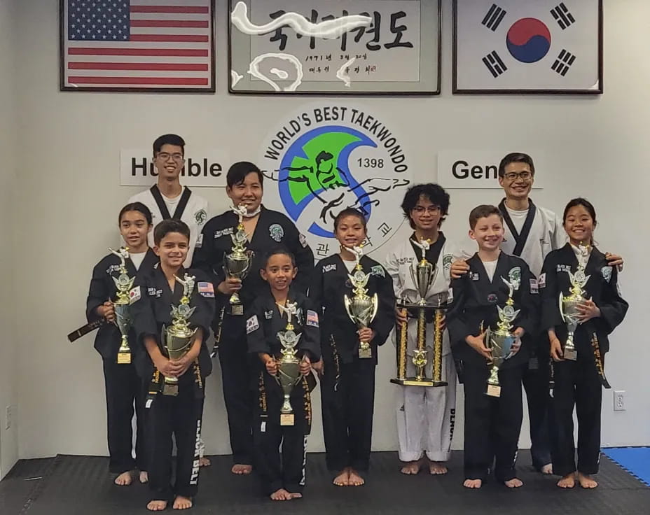 a group of people holding trophies