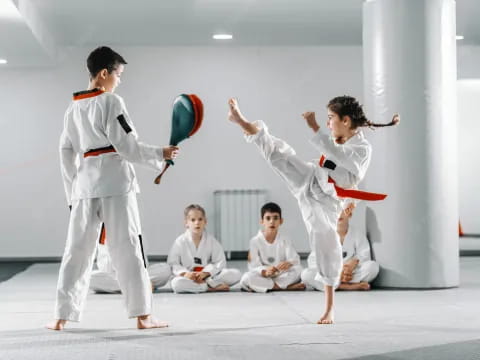 a group of people in karate uniforms