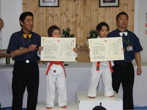 a group of people holding a certificate