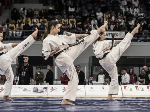 a group of people in karate uniforms