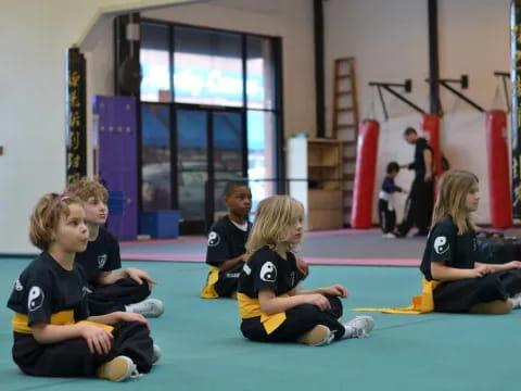 a group of children sitting on the floor