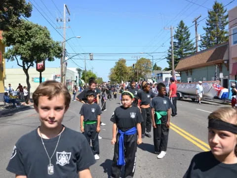 a group of people walking down a street