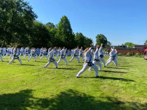 a group of people in white uniforms