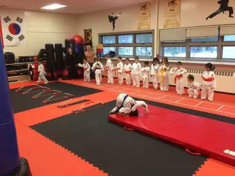 a group of children in karate uniforms