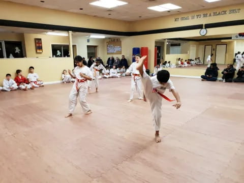 a group of people in karate uniforms