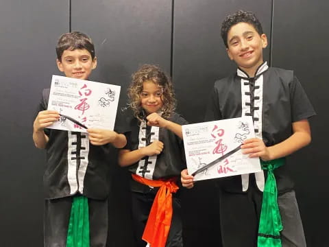 a group of children holding signs