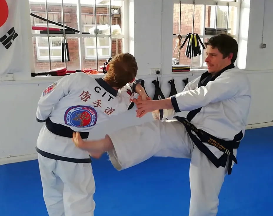 two people in karate uniforms