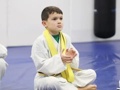 a boy sitting on the floor