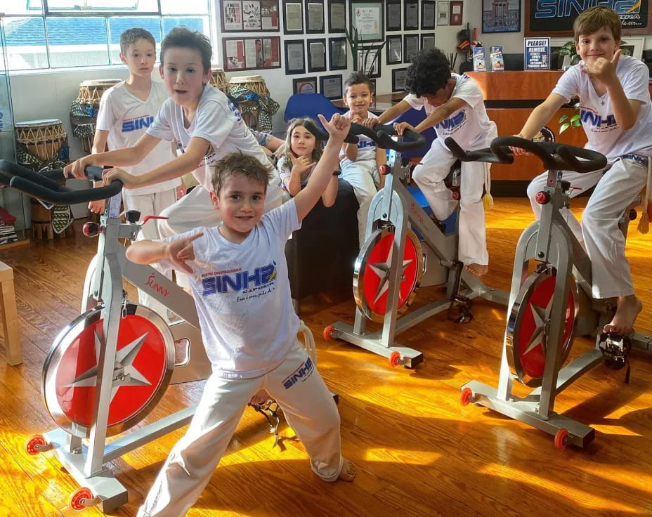 a group of people exercising on exercise equipment