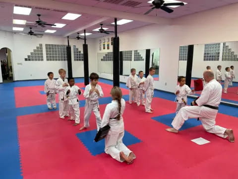 a group of people in karate uniforms