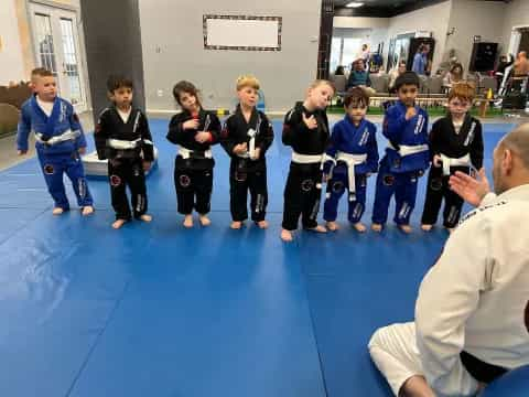 a group of children in a karate class