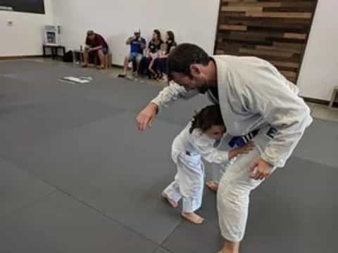 a man and a child in karate uniforms
