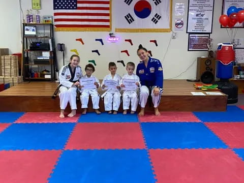 a group of people in karate uniforms