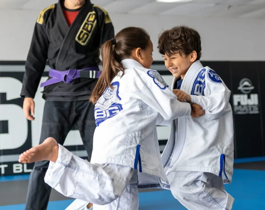 a group of people in karate uniforms