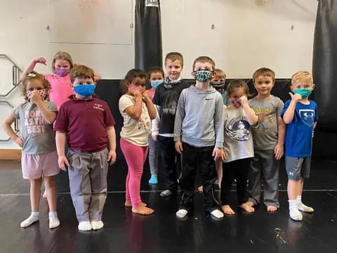a group of children wearing face masks