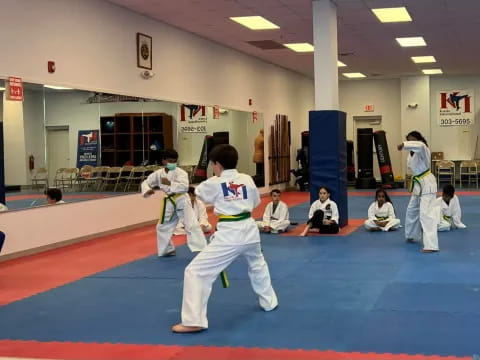a group of people in a karate class