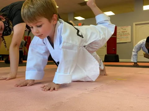 a child in a karate uniform