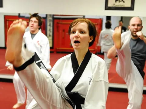 a group of people in karate uniforms