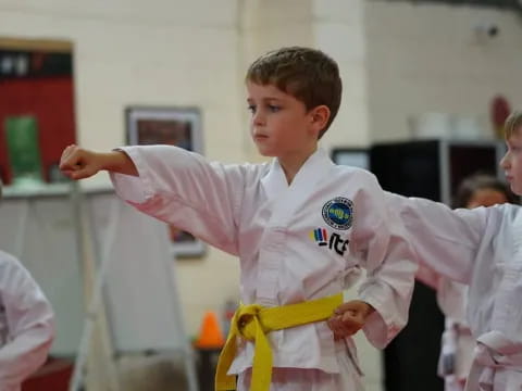 a boy in a karate uniform