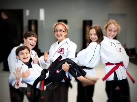 a group of people in karate uniforms