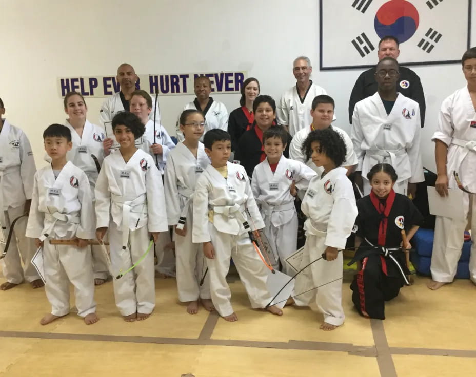 a group of people in karate uniforms