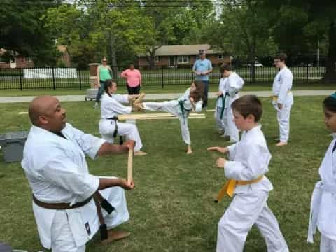 a group of people practicing martial arts