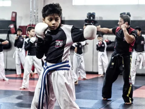 a group of people in a martial arts class