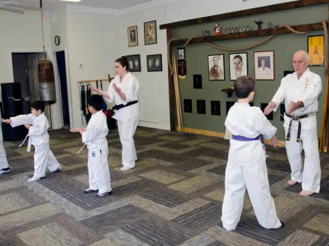 a group of people in karate uniforms