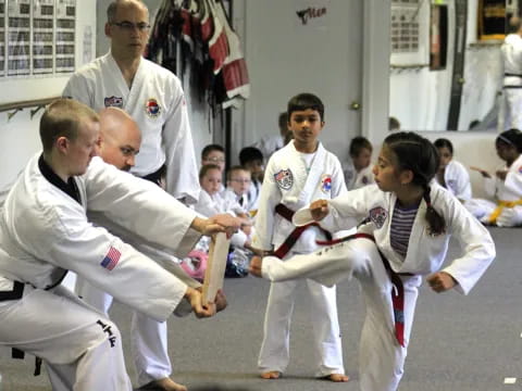 a group of people in karate uniforms