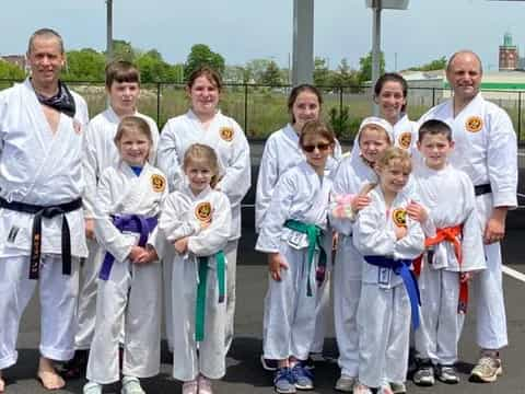 a group of people wearing karate uniforms