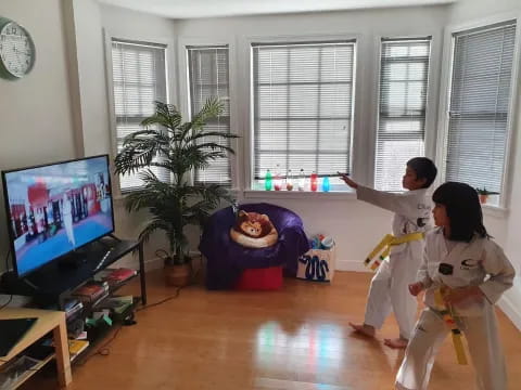kids playing video games in a living room