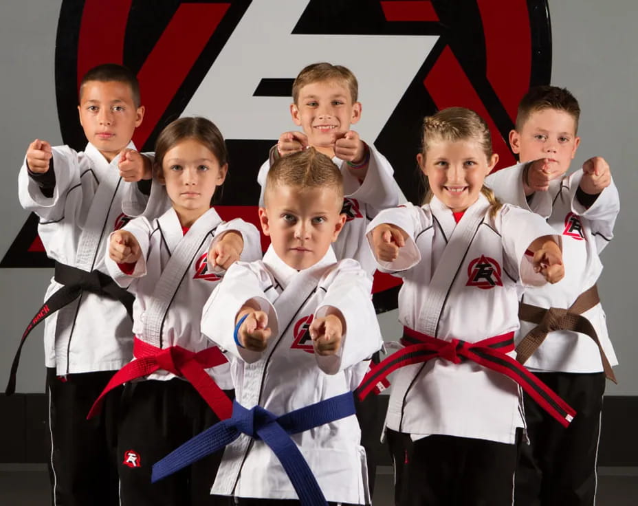 a group of boys in karate uniforms