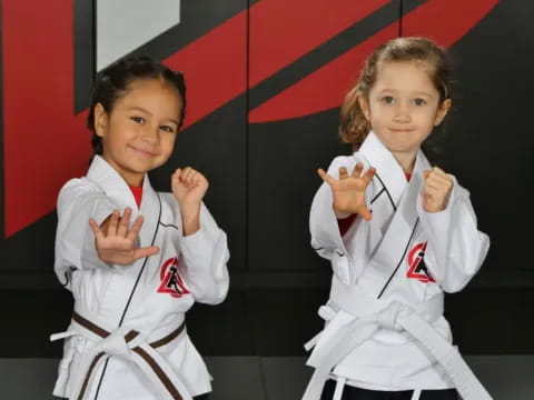 a group of girls in karate uniforms