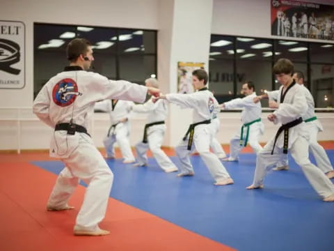 a group of people in karate uniforms