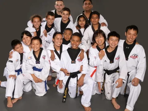 a group of people in karate uniforms