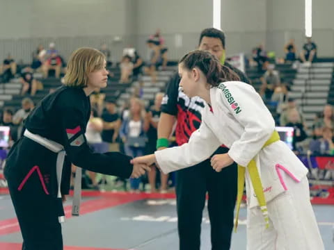 a group of people in karate uniforms