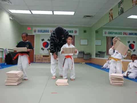 a group of people in karate uniforms