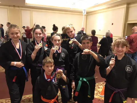 a group of kids holding tooth brushes