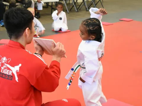 a man and a child in karate uniforms