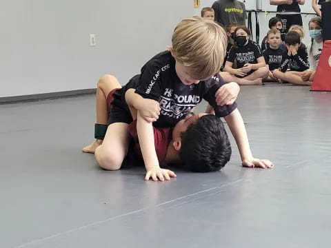a couple of people wrestling