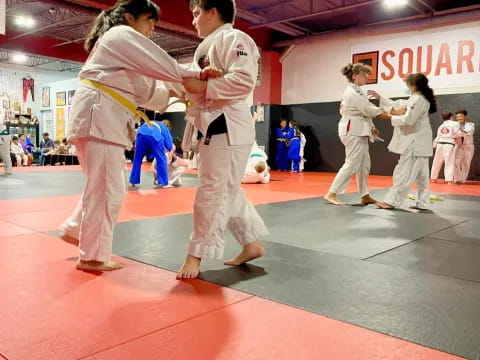 a group of people in karate uniforms