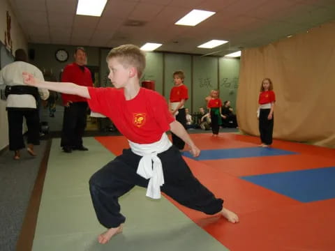 a boy in a karate uniform