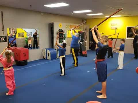 a group of children practicing in a gym