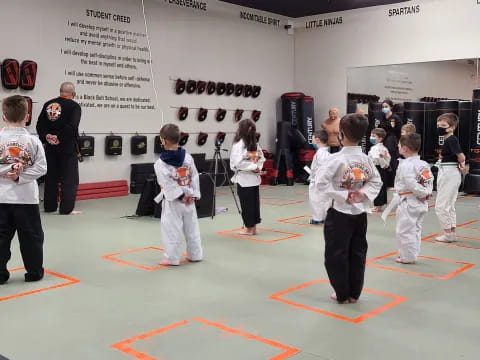 a group of people in karate uniforms