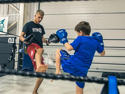 a group of men in a boxing ring